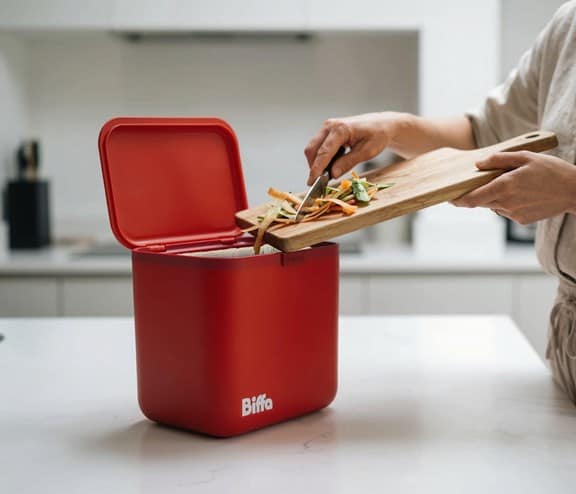 Food getting scrapped into red food caddy