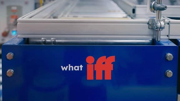 Biffa's What iff logo on the side of a conveyor belt in one of Biffa's manufacturing factory