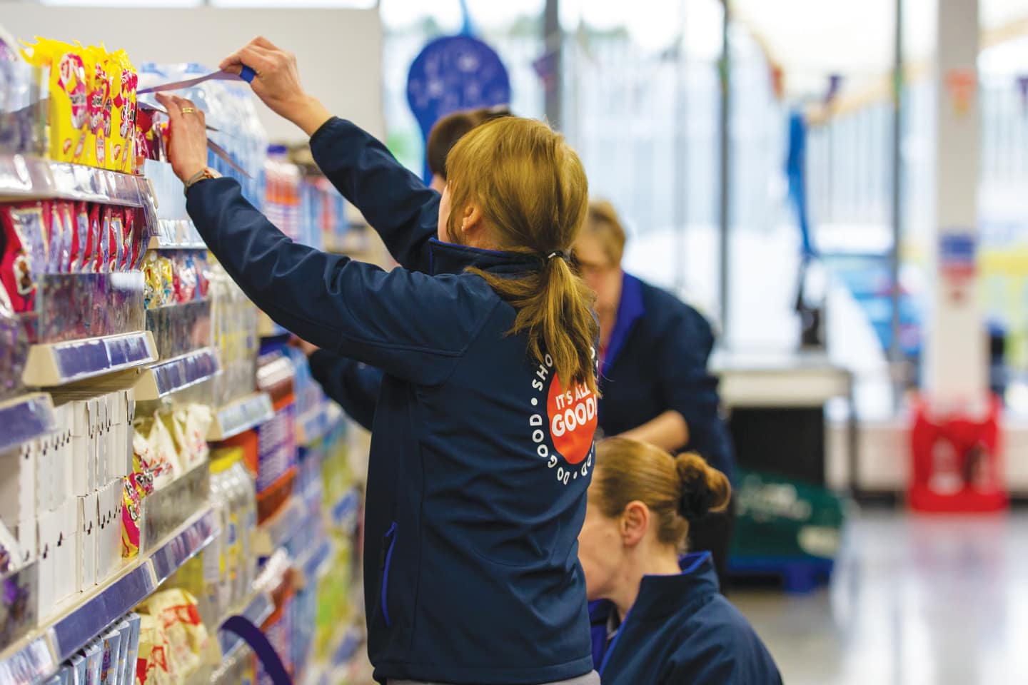 Company Shop worker stacking shelves