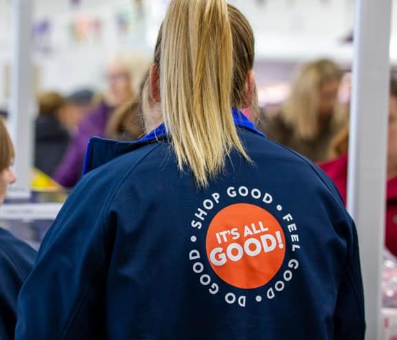 back of two company shop workers