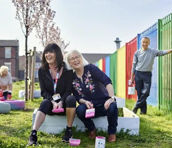 Public laughing in garden