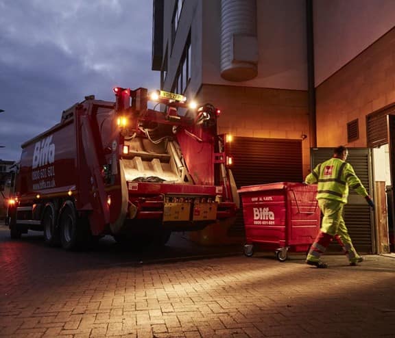 Biffa worker emptying bin
