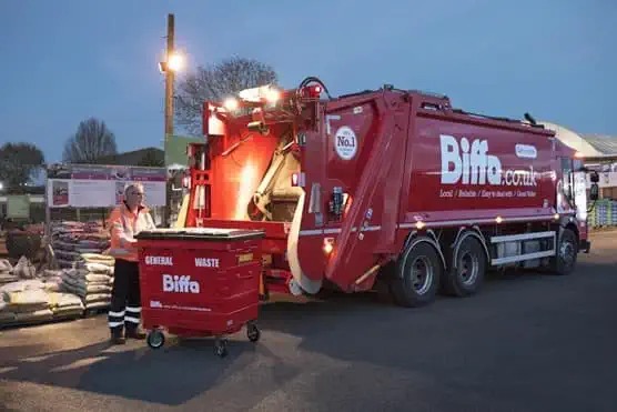 Biffa worker with bin and truck