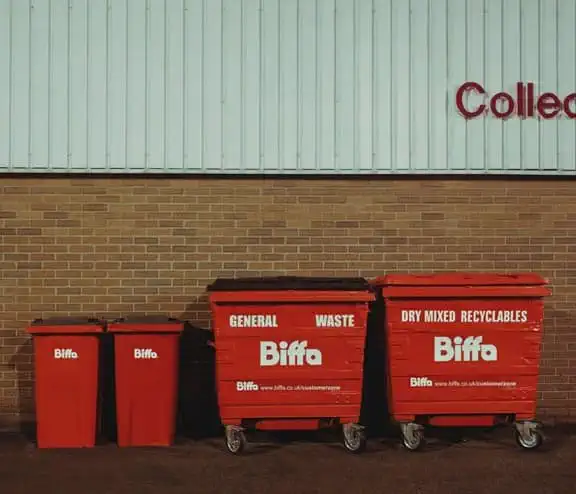 Bins lined up in front of wall