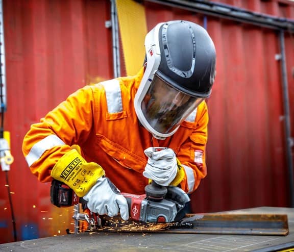 Employee working on metal at materials recovery facility