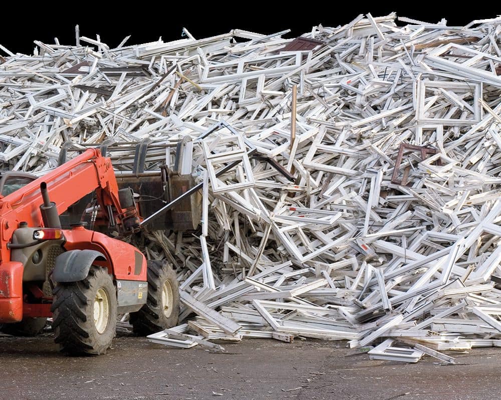 uPVC window frames moved by red loader truck