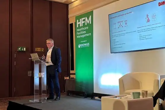 Simon speaking to a crowd on a stage at HFM 2024