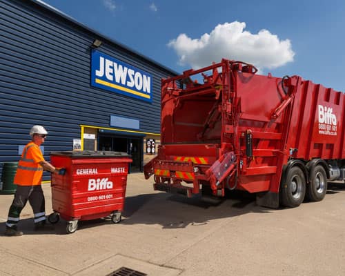 Biffa bin and truck outside Jewson branch