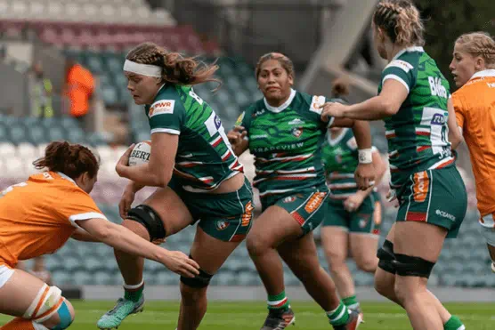 Leicester tigers players playing a match with Biffa logo on the back after renewing partnership with them