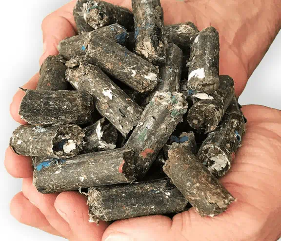 Man holding waste pellets in newly acquired Hull pellet plant