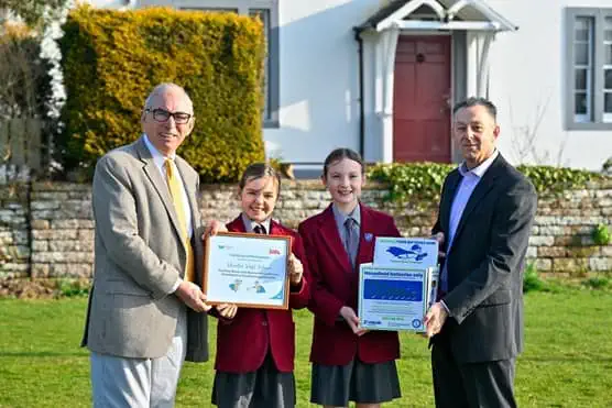 Children from Cumbria getting an award for helping to prevent fires by saving 2 tonnes of household waste