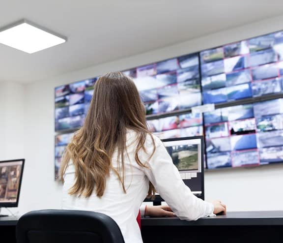 Female watching multiple screens