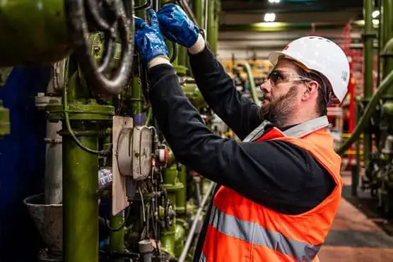 Employee working on machinery