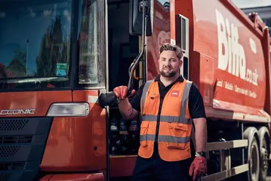 Male employee next to Biffa vehicle