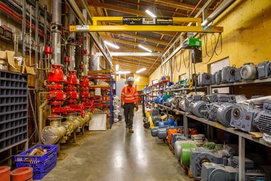 Biffa operative going through a waste management factory
