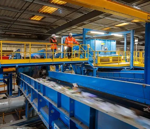 Man from Biffa is overlooking waste services in factory