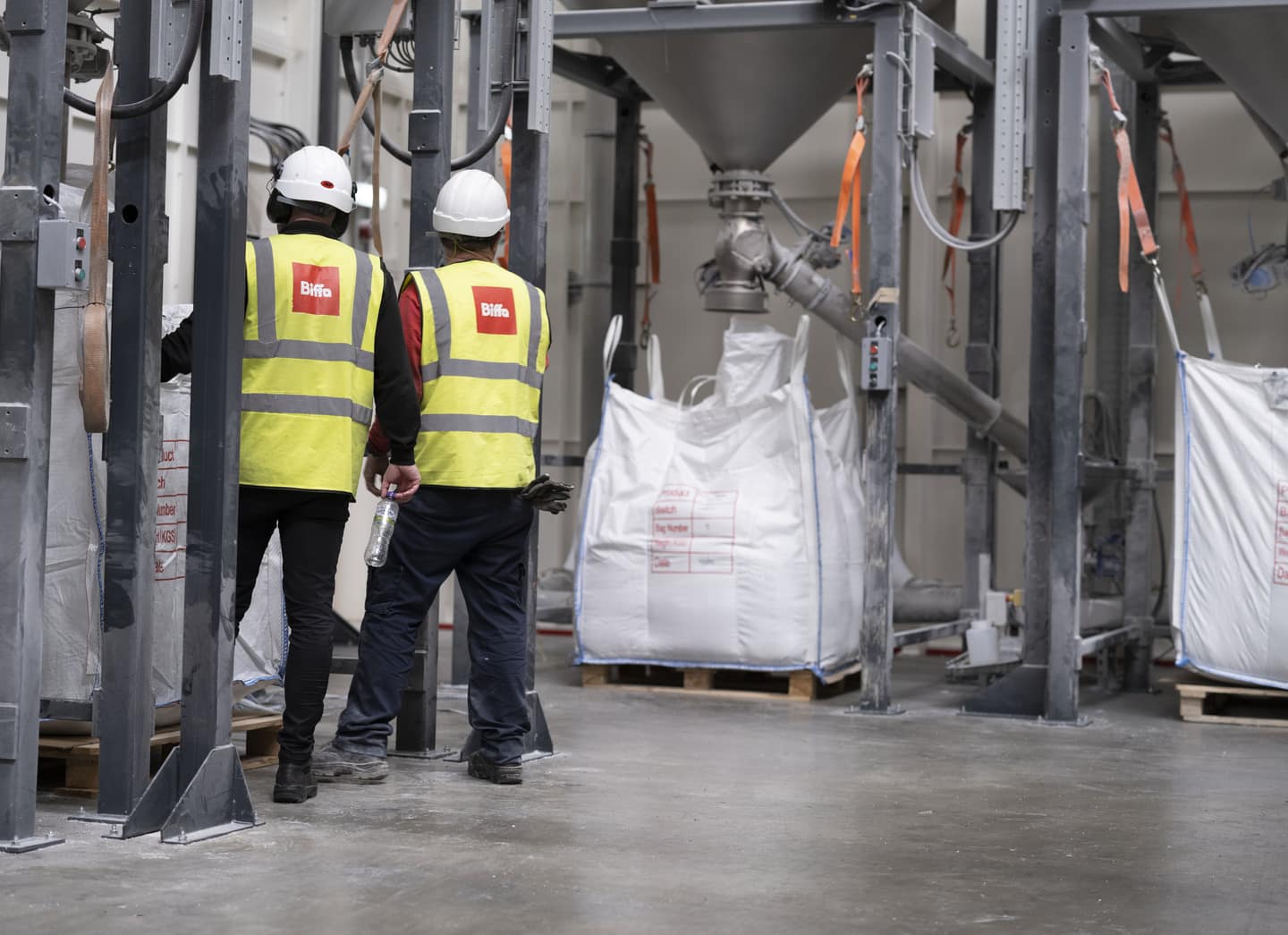 Biffa staff loading polypropylene sacks at recycling commodities facility