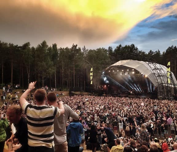 Crowd facing stage at festival