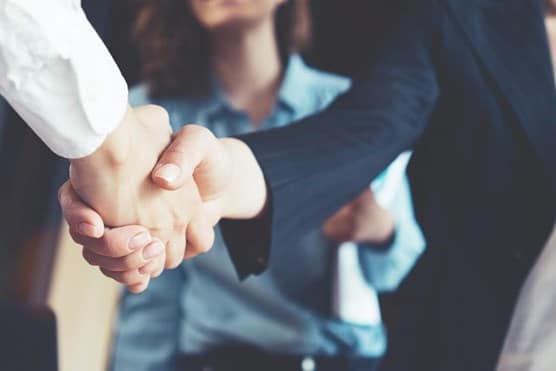 business people shaking hands in the office