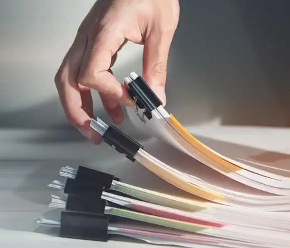 Man holding reporting documents filed