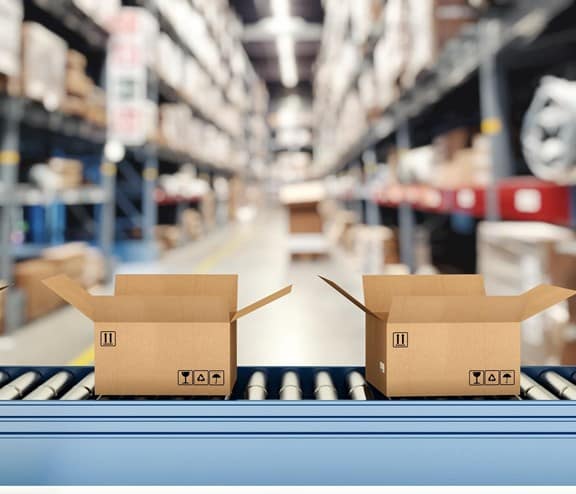 Boxes on conveyor belt in warehouse